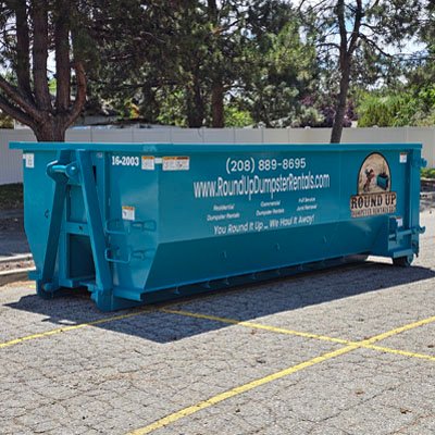 Round Up Dumpster Rentals 20-yard roll-off container with driveway protection boards